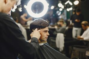 stylish-man-sitting-in-a-barbershop-2024-04-15-18-54-52-utc.jpg